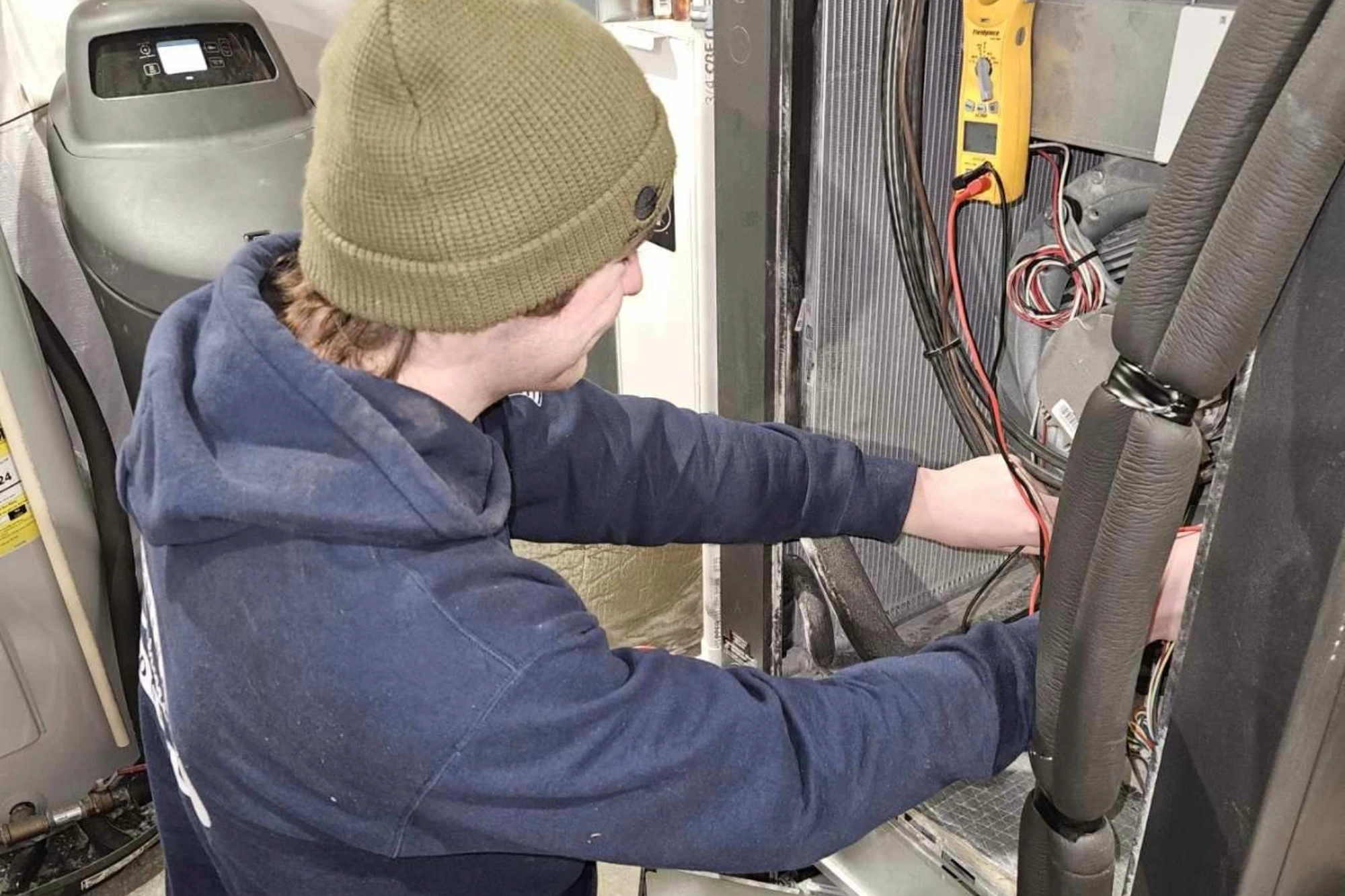 Schmidt heating technician repairing furnce 